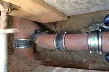 A spot repair of a residential sewer lateral with clay pipe VCP.